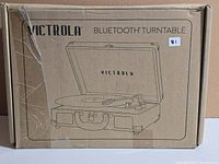 Front of sealed retail box with Victrola Bluetooth Turntable illustration