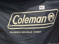 Coleman logo and Queen Single High text on storage bag