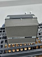 Projector closed with cover showing Bell & Howell Autoload branding