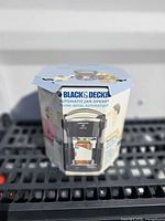 Box front showing Black & Decker Lids Off Automatic Jar Opener text and image