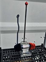 Full view of shoe buffer showing handle, housing, dual pads