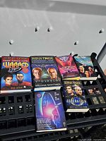 Group shot showing all eight Star Trek books arranged on black crate
