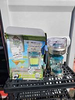 Machine, glass jar, original box displayed