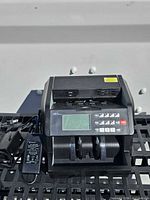 Front view of Royal Sovereign RBC-EG100 bill counter with attached adapter