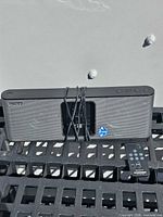 Front view of Sony RDP-X200iP docking speaker with remote and power cable