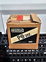 Closed Eumig-branded cardboard box