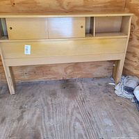 Front view of headboard showing storage doors and shelves