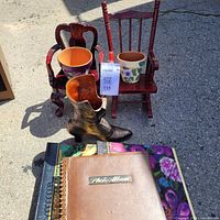 Group shot showing miniature chairs, boot planter, terracotta planters, photo albums