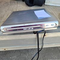 Top view of Magnasonic DVD player showing slim profile and silver finish