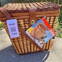 closed wicker picnic basket with original tag