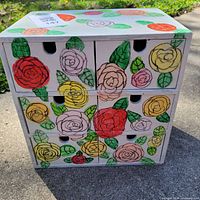 Front view of hand painted 9-drawer chest