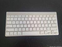 Top view of the Apple aluminum wireless keyboard showing key layout and condition