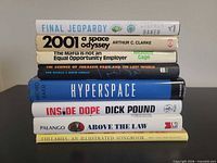 Stack of eight books showing spines