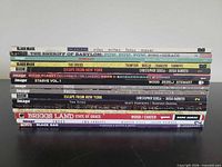 Stack of trade paperbacks showing titles and publishers