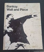 Front cover showing title and Banksy artwork