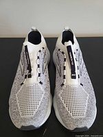 Top view of both shoes showing knit uppers and pull tabs