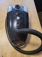 Top view of Kenmore canister vacuum showing hose attachment and controls