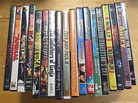 Single photo of 22 DVD cases standing upright showing spine titles