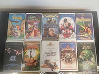 Front covers of ten of the VHS tapes displayed on table