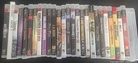 Row of approx. 25 PS3 game cases showing spines