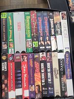 Box of two rows of VHS tapes showing titles such as Ocean's Eleven, Spider-Man, The Abyss