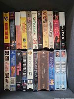 Front view of two rows of VHS tapes inside box
