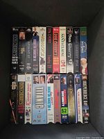 First bin view showing two rows of VHS tapes including Apollo 13, Titanic, Don Cherry volumes, Independence Day