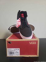 Front view of one shoe on box with tag visible