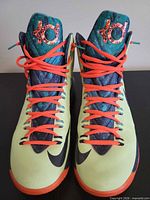 Top view showing pair of KD 5 sneakers, laces, tongue logos