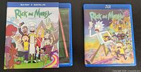 Front covers of Rick and Morty Season 1 and Season 2 Blu-ray sets with cases