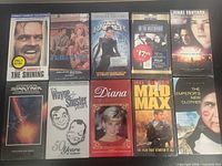 Front covers of all ten sealed VHS tapes