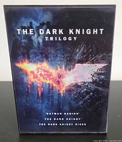 Front of slipcase showing The Dark Knight Trilogy title and bat logo