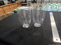 Two Bodum double-walled glasses side by side with ruler for scale