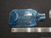 Blue melted glass bottle tray beside 12 in. ruler showing ~11 in. length