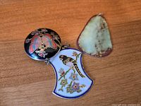 Front views of three pendants