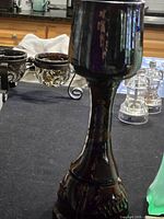 Pottery chalice close-up with background items
