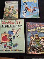 All four books laid out cover up