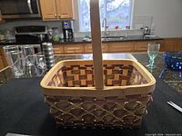 Full view of rectangular woven basket with handle