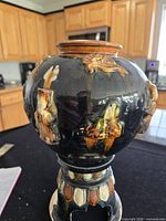 Front view of globular sancai vessel on pedestal