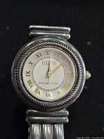 Front view of Ecclissi sterling silver watch showing dial, bezel and hands