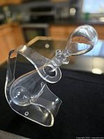 front angle of acrylic holder with glass bottle seated