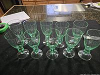 Overhead view of all ten green bubble goblets