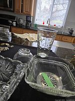 Group shot showing Capri Dot vase, square pressed glass bowl, small bee bowl, and rectangular pressed glass tray
