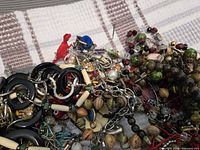 pile of assorted jewellery highlighting chains, beads and pendants