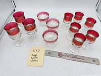 Group shot showing all eight goblets, four sherbets, ruler for scale