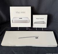 Mac mini retail box, Magic Trackpad box, additional long Apple box