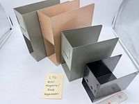 Group of five metal organizers standing upright