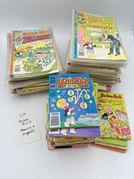 Stacks of bagged Richie Rich standard comics and digests