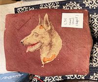 top view of footstool showing dog needlepoint design