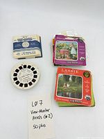 Lot overview showing stacks of sleeved reels, loose reels and handwritten count note